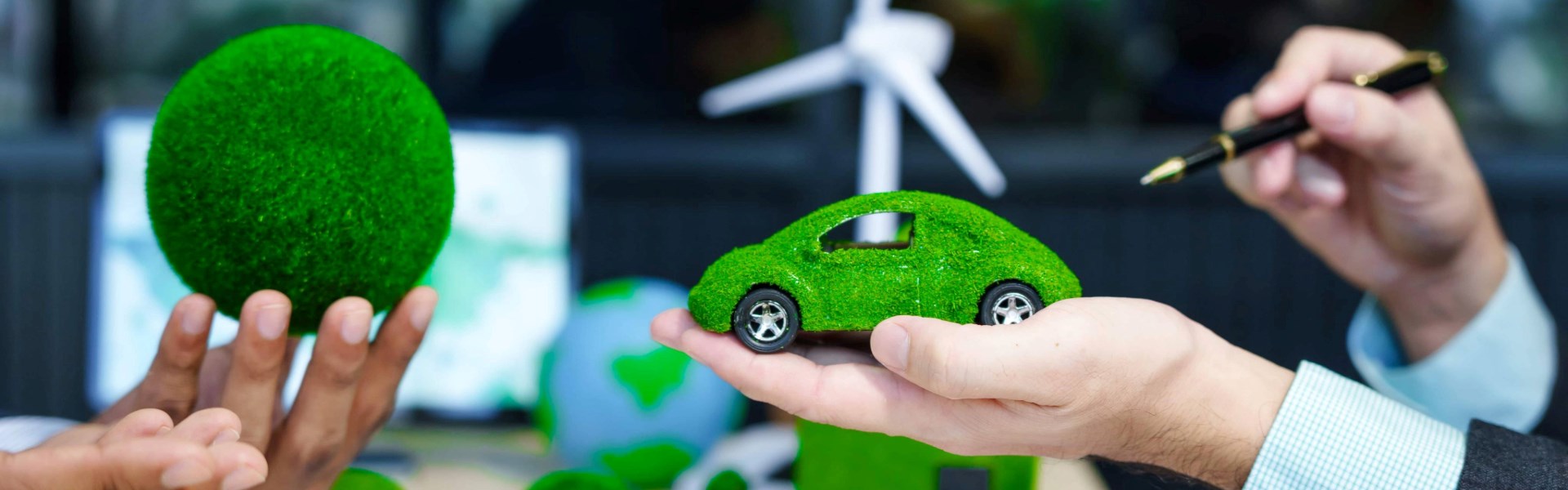 Sustainable Future Green Car On Hand With Windmil 2026 09 23 20 18 13 Utc (1) (2)