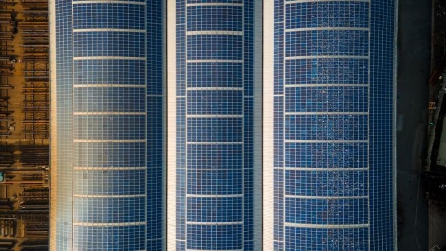 Aerial View Of Solar Panels On Warehouse Top Roof In Industrial Estate Getty (1)